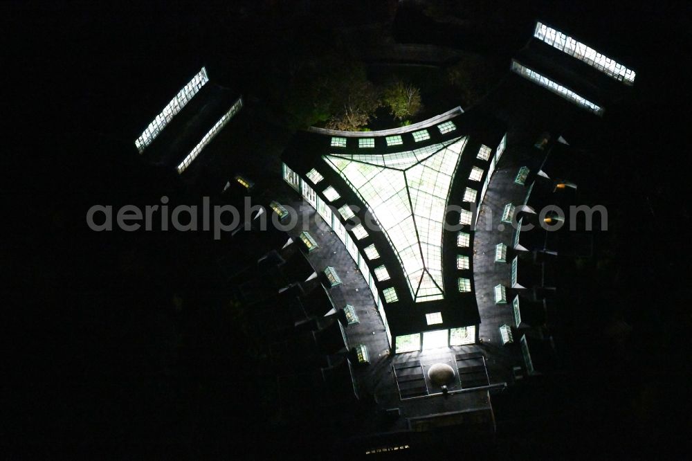 Aerial image at night Berlin - Night lighting zoo grounds at the Alfred Brehm House in Tierpark in the district of Friedrichsfelde in Berlin, Germany