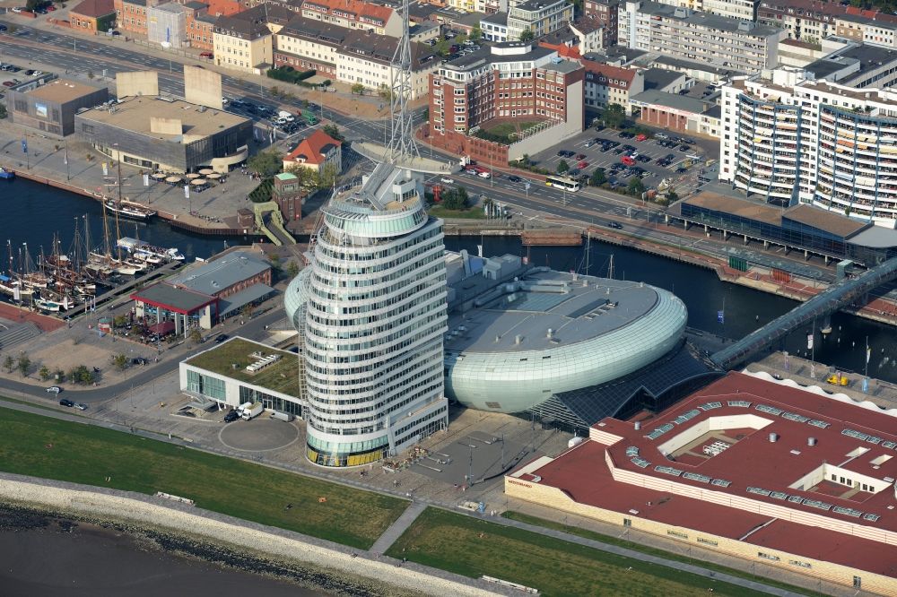 Bremerhaven from above - Atlantic Hotel Sail City and Klimahaus in Bremerhaven in the state of Bremen. The four star hotel with its bent front is located adjacent to the exhibition space of Klimahaus Bremerhaven 8° Ost and on the riverbank of the Weser