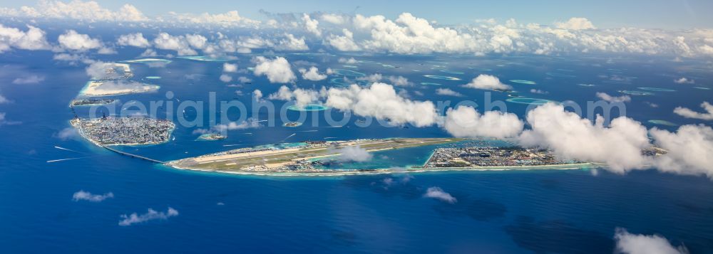 Male from above - Atoll on the water surface Hulhule Island and Male on street Airport Main Road in Male in Maldives