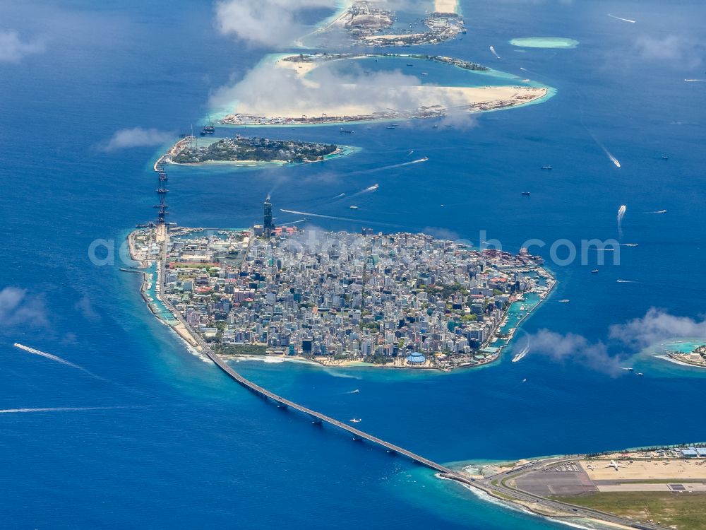 Male from the bird's eye view: Atoll on the water surface Male on street Majeedhee Magu Road in Male in Maldives