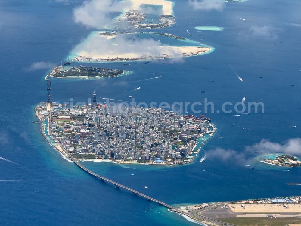 Male from the bird's eye view: Atoll on the water surface Male on street Majeedhee Magu Road in Male in Maldives