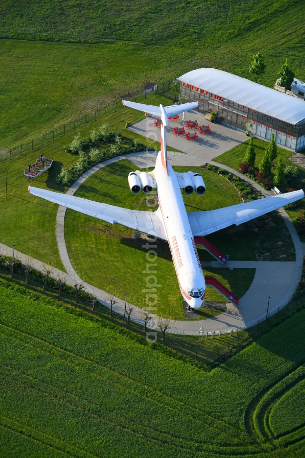 Stölln from above - Discharged passenger aircraft IL-62 of the GDR - airline INTERFLUG Lady Agnes on a parking area in Stoelln in the federal state Brandenburg, Germany
