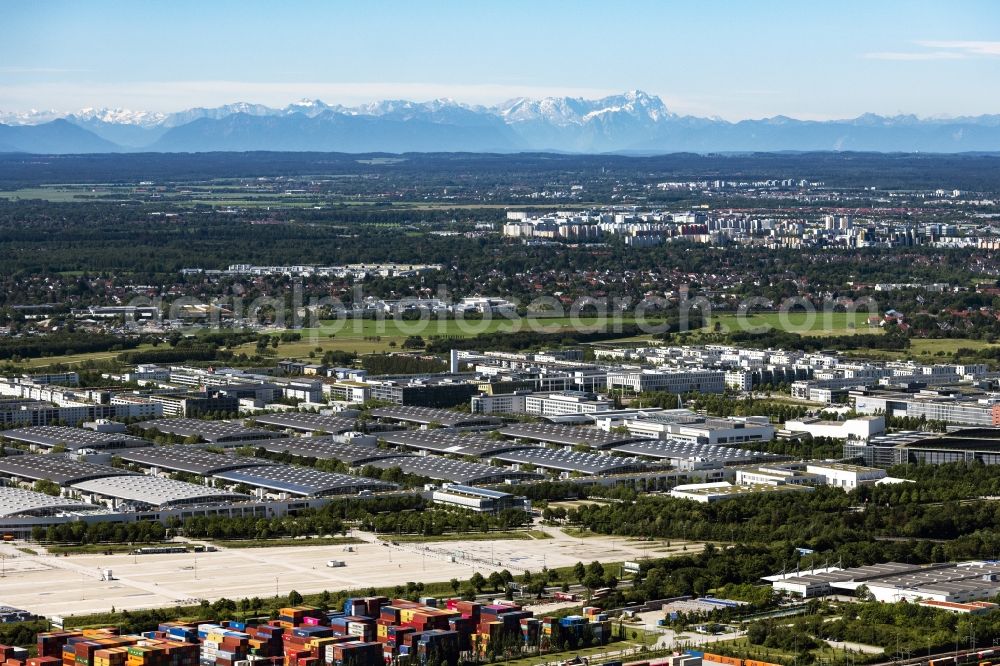 München from above - Exhibition grounds and exhibition halls of the Messe Muenchen with the mountain range of the Alps in the background in Munich in the state Bavaria