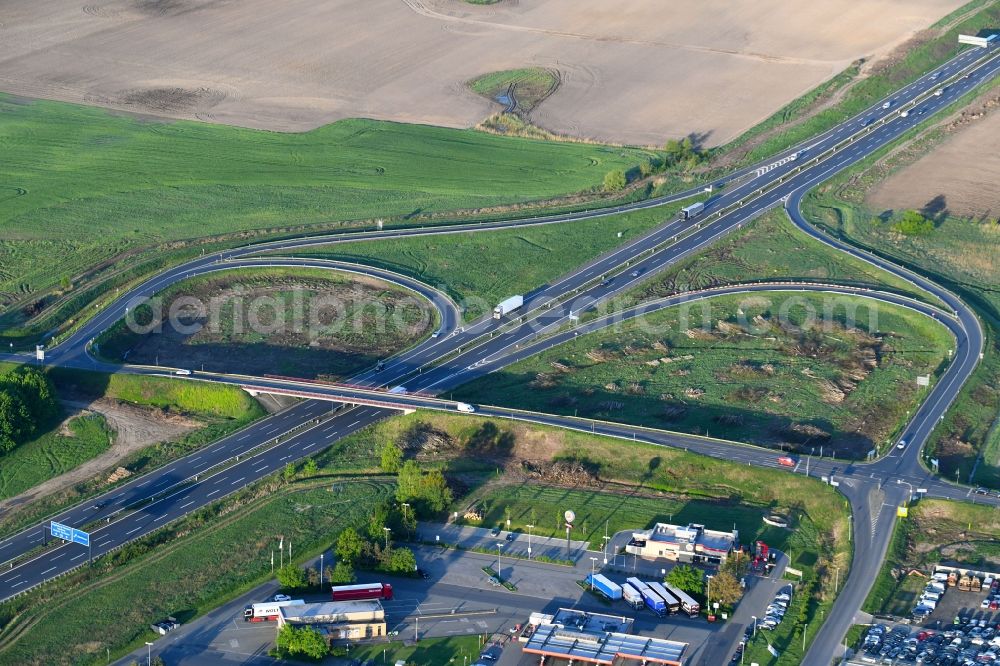 Oberkrämer from above - Routing and traffic lanes during the highway exit and access the motorway A10 in Oberkraemer in the state Brandenburg, Germany