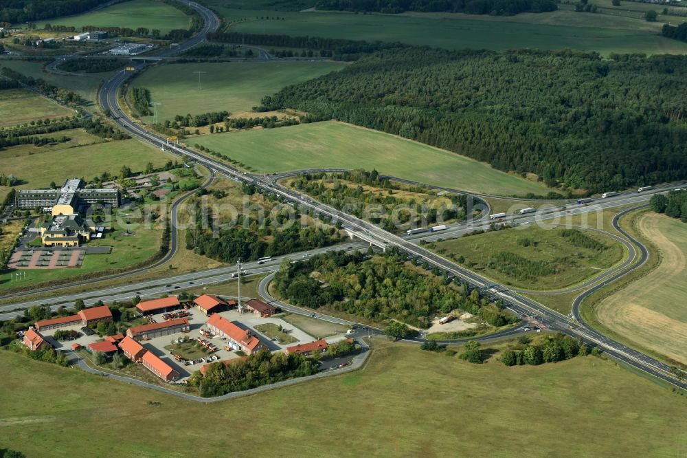 Rangsdorf from the bird's eye view: Routing and traffic lanes during the highway exit and access the motorway A 10 - B96 in Rangsdorf in the state Brandenburg