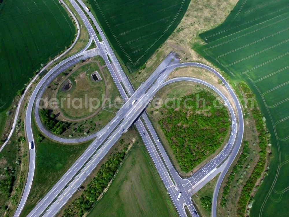 Bennstedt from above - Routing and traffic lanes during the highway exit and access the motorway A 143 to the B80 in Bennstedt in the state Saxony-Anhalt, Germany