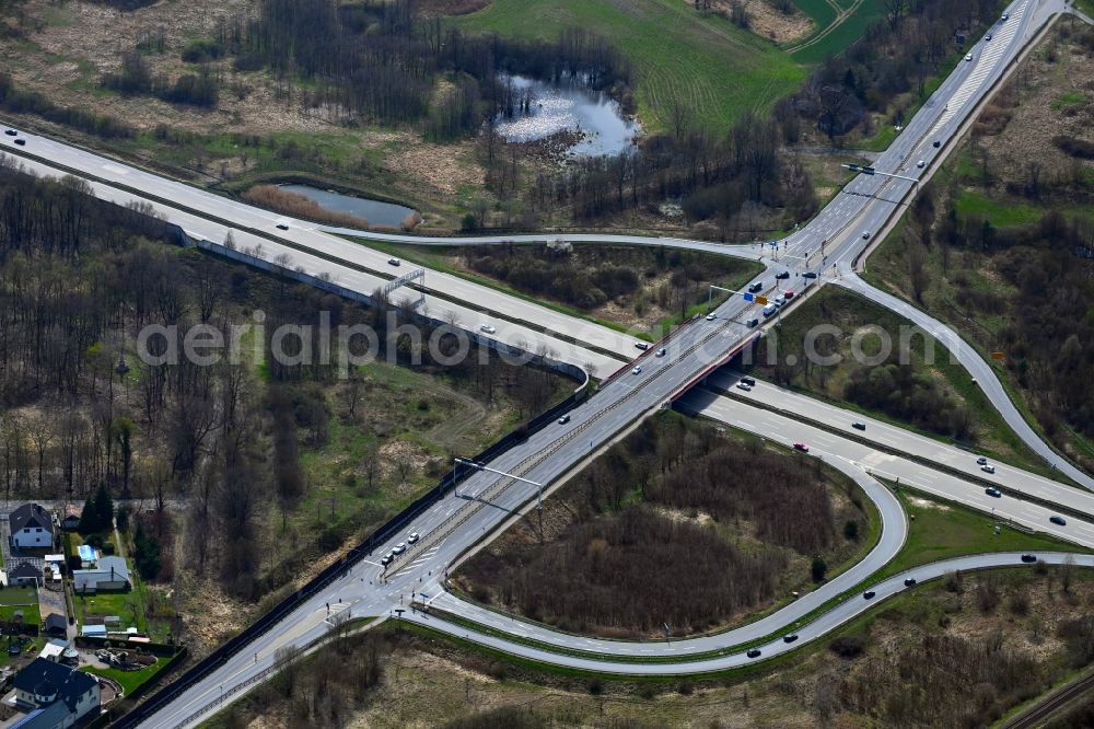 Blumberg from above - Route and lanes in the course of the exit and access of the motorway junction of the BAB A10 Berlin-Hohenschoenhausen in Blumberg in the state Brandenburg, Germany