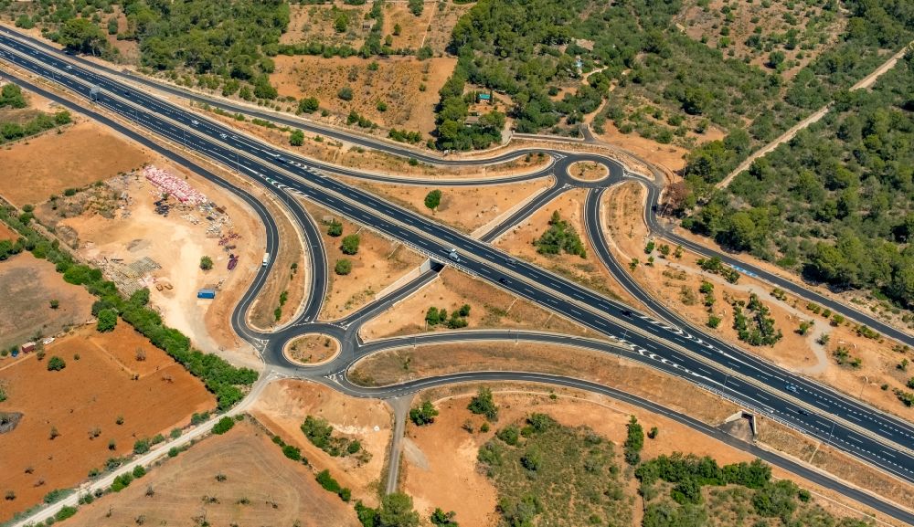 Campos from above - Route and lanes in the course of the exit and access of the motorway junction of the Ma-19 at the Cami de Cas Rubins in Campos in Islas Baleares, Spain