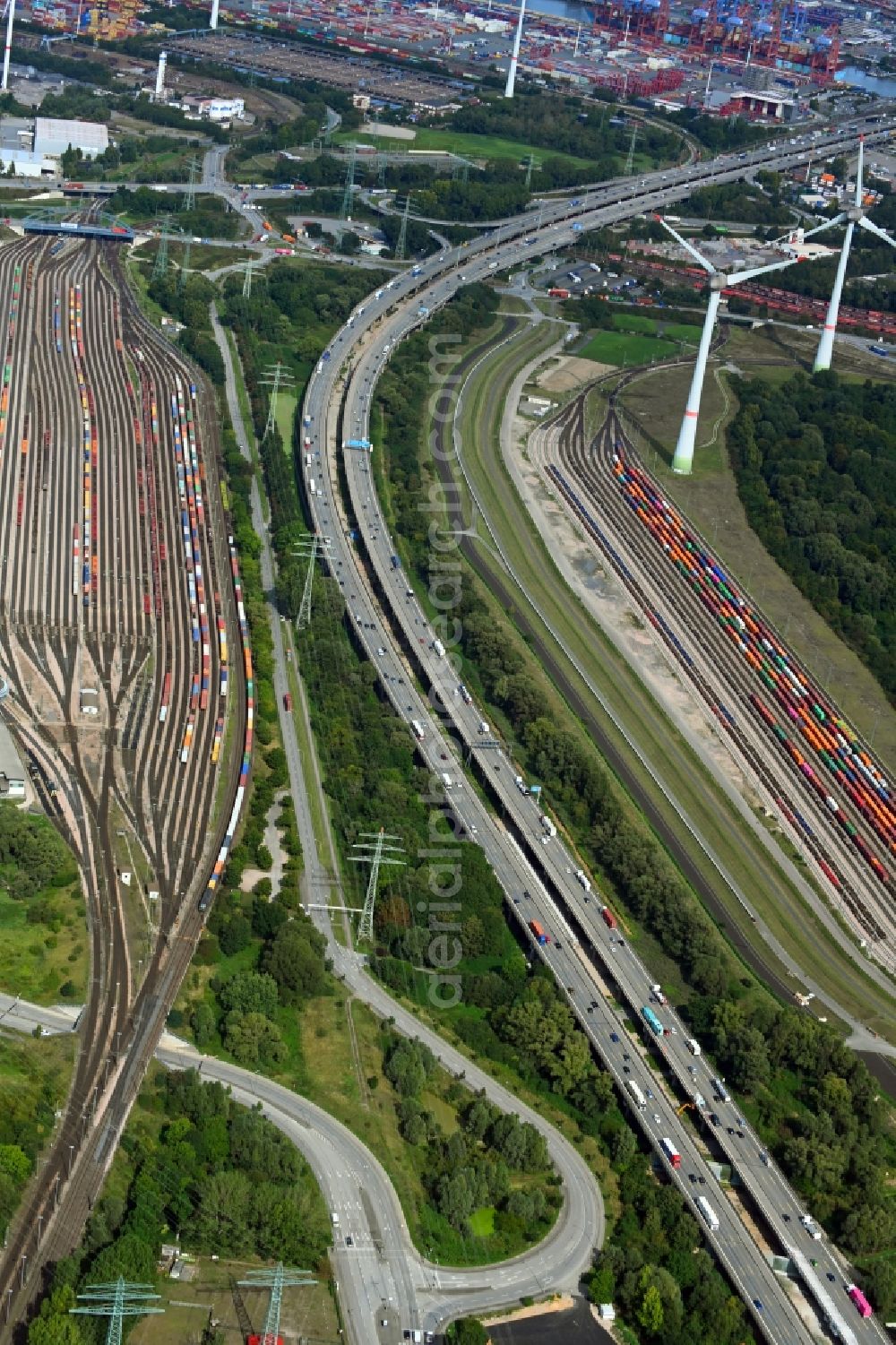 Hamburg from the bird's eye view: Lanes of the motorway- route and course of the A7 in Front of railway marshalling yard in the district Altenwerder in Hamburg, Germany