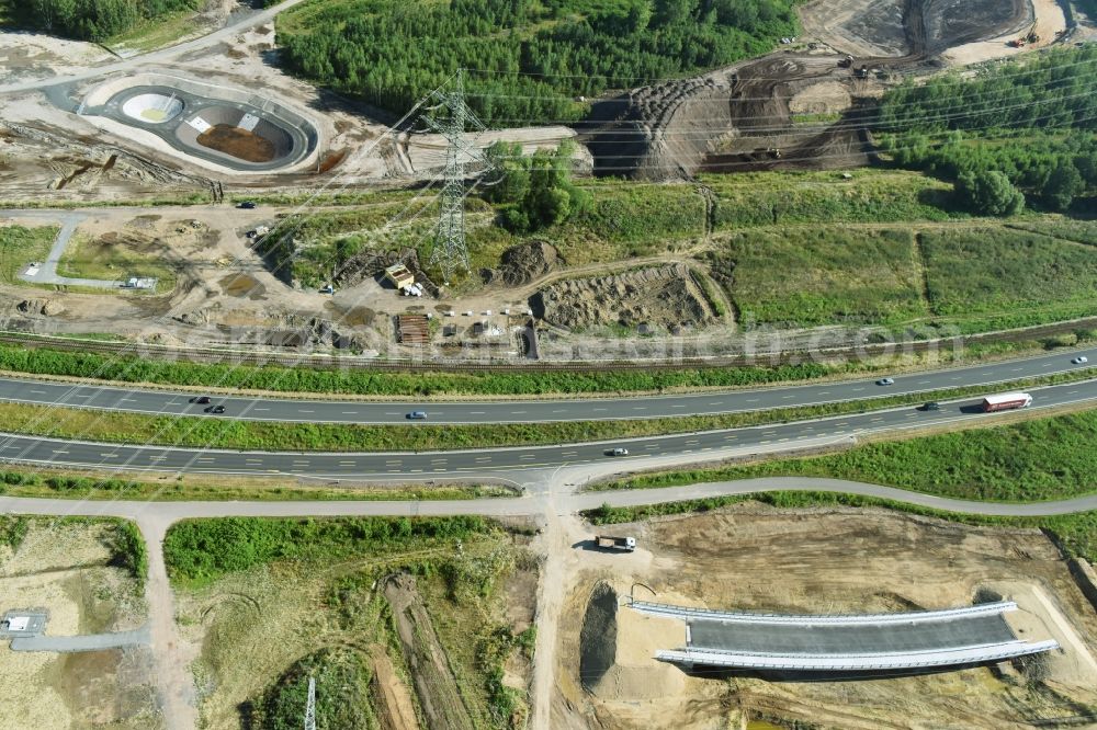 Aerial photograph Rötha - Finished bridge construction and stormwater retention tanks and fire water pond - Highway- Construction site with earthworks along the route and of the route of the highway route B95 to A72 motorway in Roetha in the state Saxony