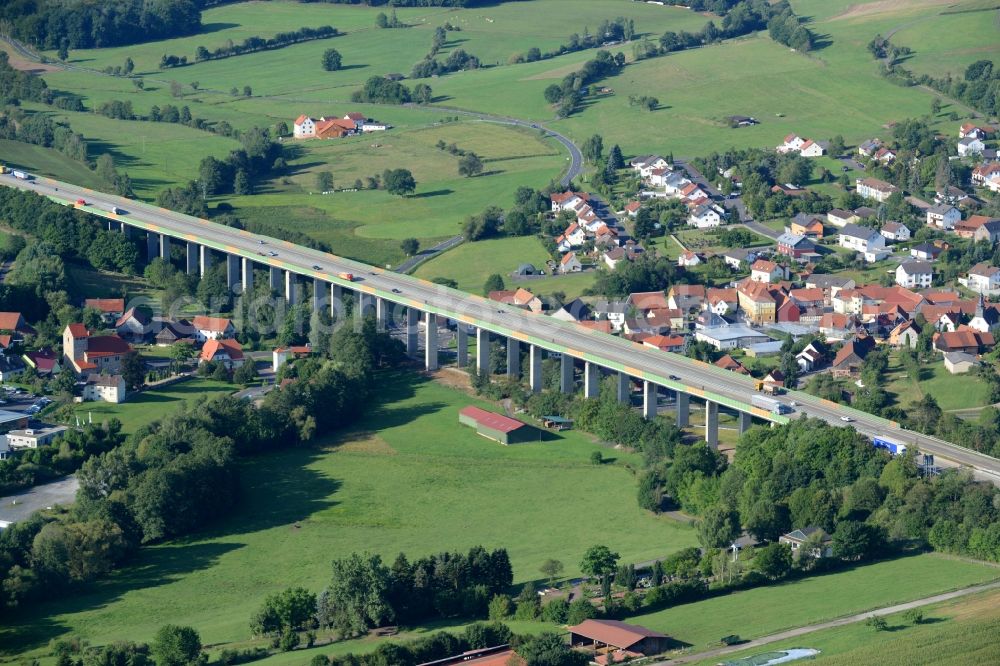 Uttrichshausen from above - Routing and traffic lanes over the highway bridge in the motorway A7 in Uttrichshausen in the state Hesse