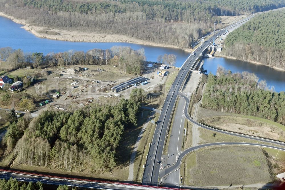 Aerial image Petersdorf - Routing and traffic lanes over the highway bridge in the motorway A 19 and new construction site in Petersdorf in the state Mecklenburg - Western Pomerania