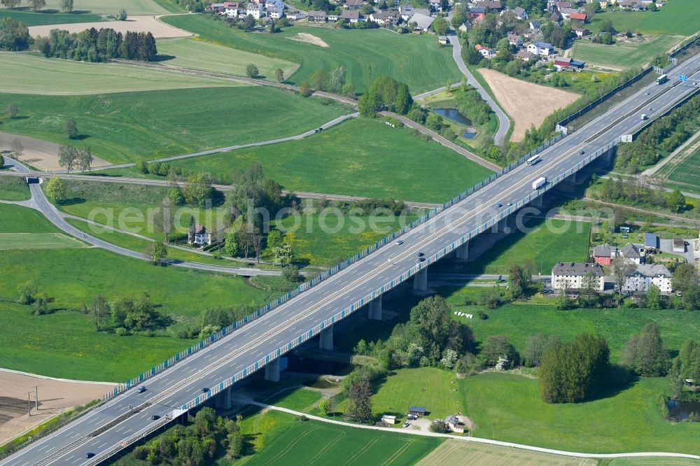 Münchberg from above - Routing and traffic lanes over the highway bridge in the motorway A 9 in Muenchberg in the state Bavaria, Germany