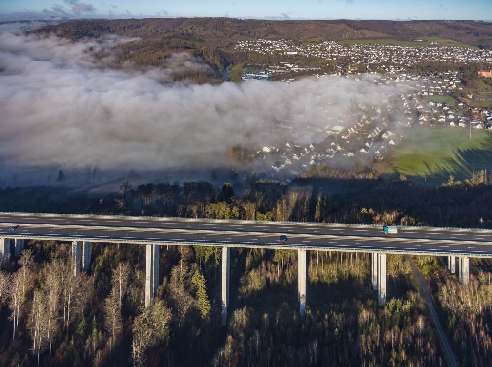 Aerial image Arnsberg - Fog clouds on routing and traffic lanes over the highway bridge in the motorway A 46 - Talbruecke Huenenburg in Arnsberg at Ruhrgebiet in the state North Rhine-Westphalia, Germany