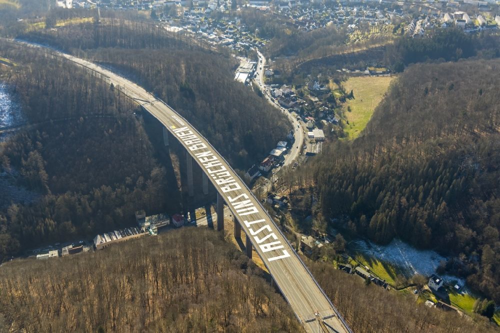 Oberrahmede from the bird's eye view: Lettering Let us build bridges (LASST UNS BRUeCKEN BAUEN) on the locked Autobahn bridge of the BAB A45 Talbruecke Rahmede in Oberrahmede in the state North Rhine-Westphalia, Germany