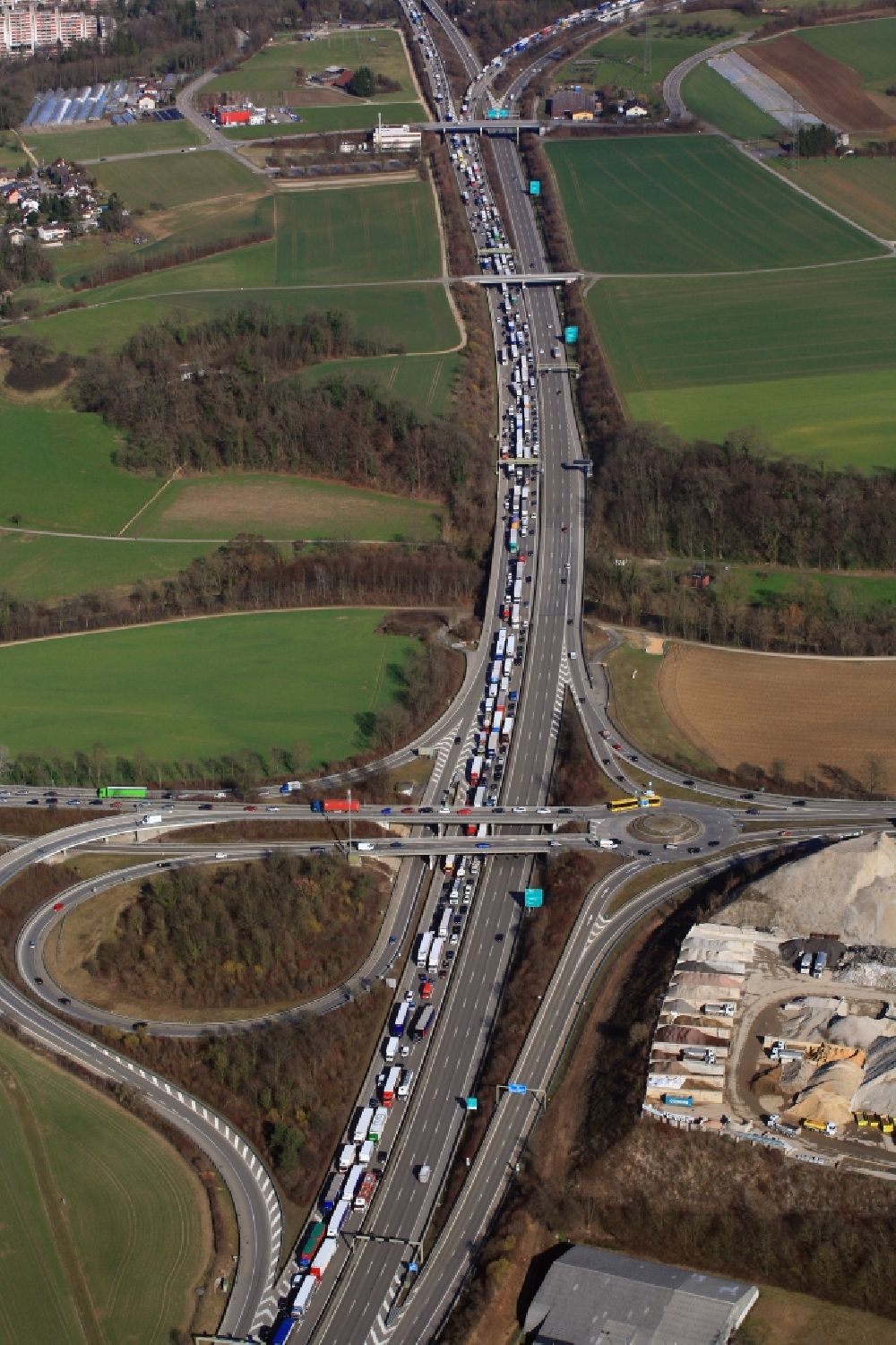 Pratteln from above - Highway congestion along the route of the lanes of motorway A3 in Pratteln in the canton Basel-Landschaft, Switzerland