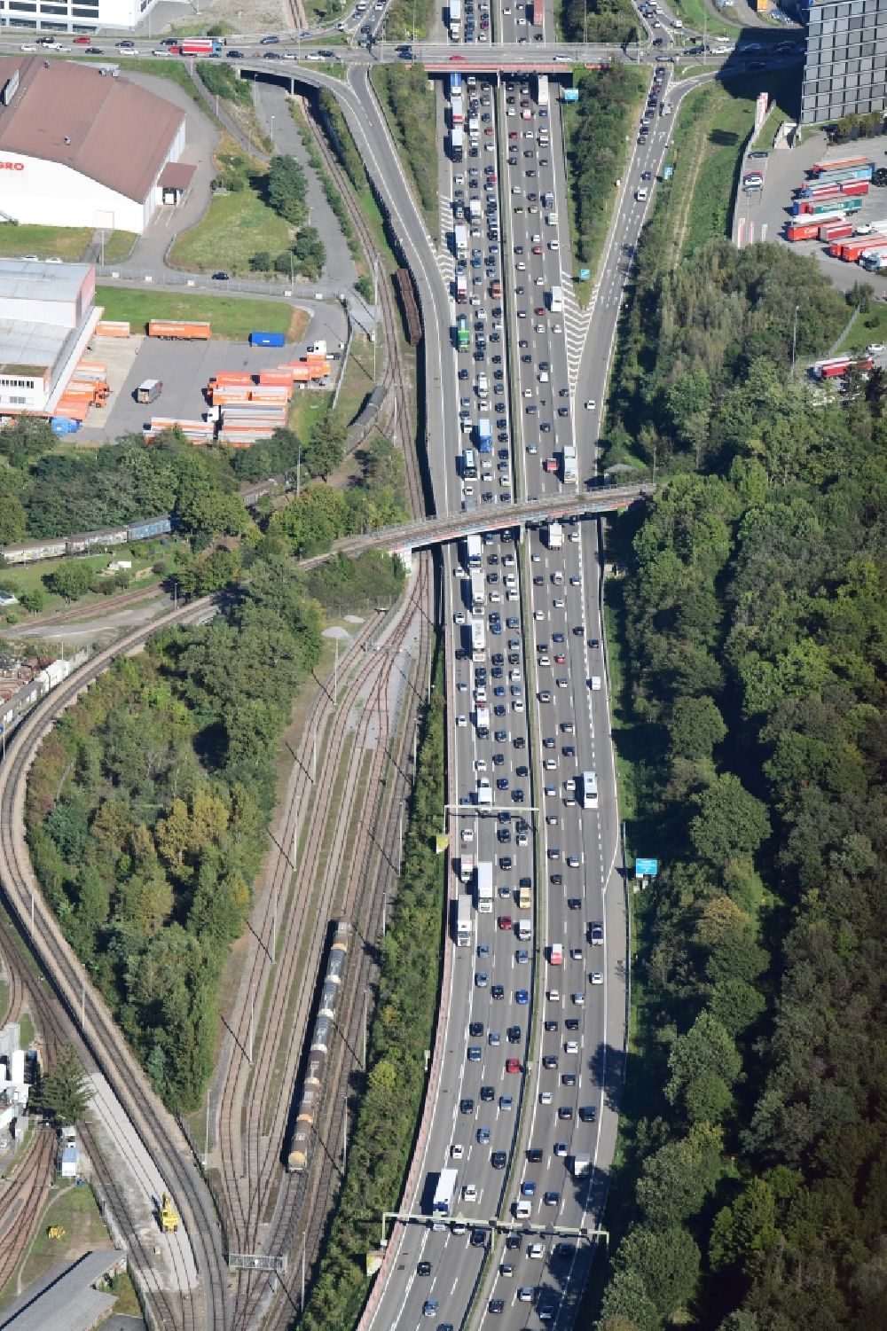 Pratteln from the bird's eye view: Highway congestion along the route of the lanes of the swiss motorway A2 / A3 in Pratteln next to Basle in the canton Basel-Landschaft, Switzerland
