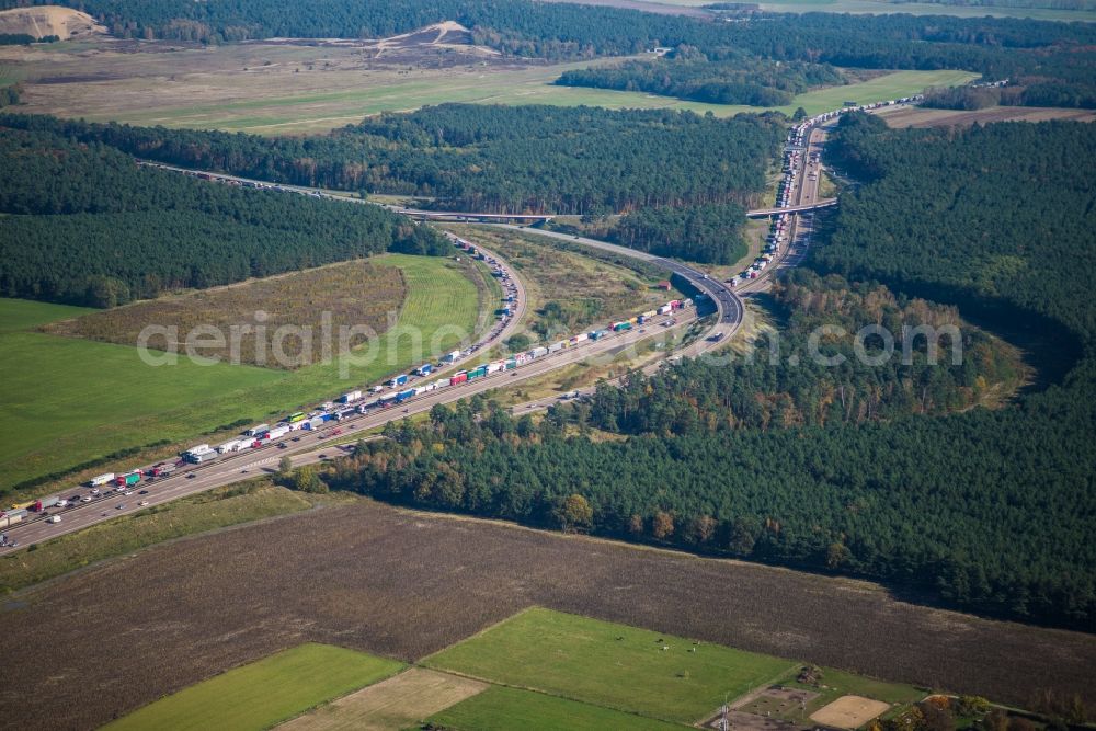 Aerial image Michendorf - Highway triangular departure of AD the BAB A10 - A115 with itself tightly marveling road with truck traffic in Nuthetal in Brandenburg. Operator is the country operating Strassenwesen Brandenburg