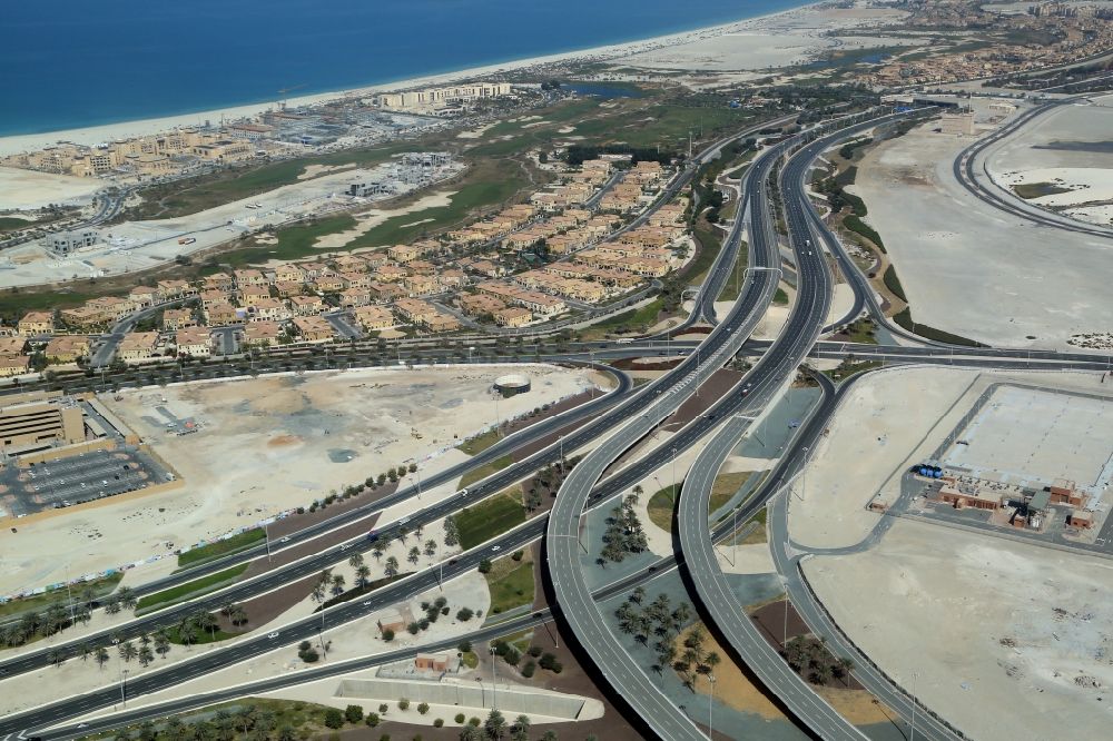 Abu Dhabi from above - Highway triangle of the federal motorway Sheikh Khalifa Bin Zayed Highway on the Saadyat in Abu Dhabi in United Arab Emirates