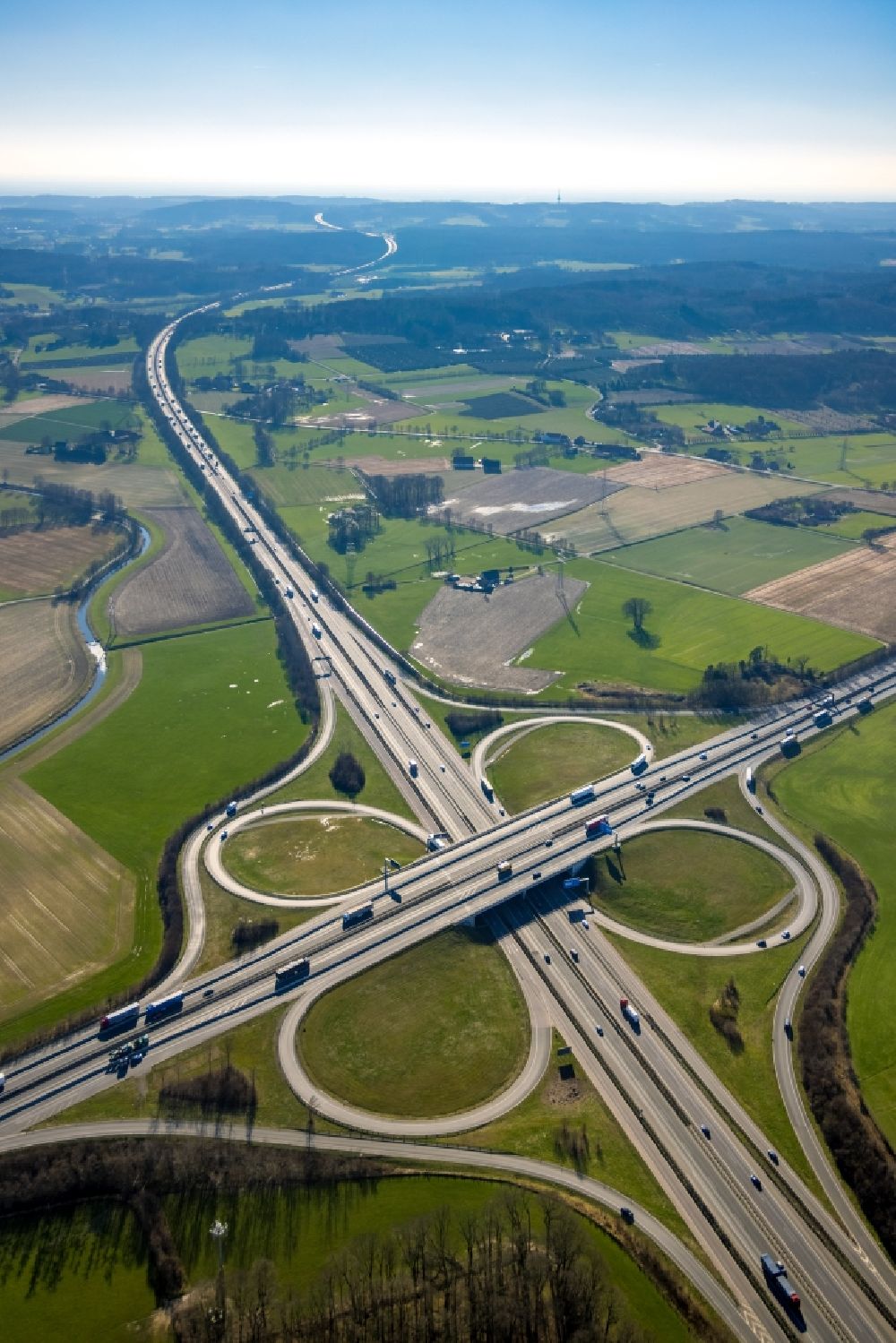 Aerial image Lotte - Traffic flow at the intersection- motorway A30 - A1 Kreuz Lotte/Osnabrueck in form of cloverleaf in Lotte in the state North Rhine-Westphalia, Germany