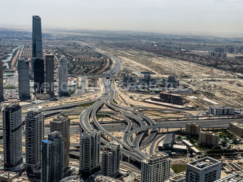 Dubai from above - Traffic flow at the intersection- motorway A Sheikh Zayed Rd on street Garn Al Sabkha Street in Dubai in United Arab Emirates