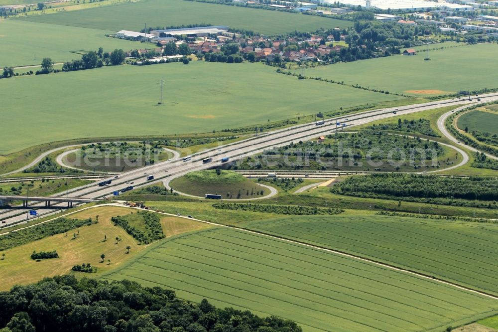 Erfurt from the bird's eye view: At the junction Erfurt in Thuringia the motorways A4 and A71 cross far from the state capital of Thuringia. The major construction project the Thuringian Forest Highway was connected to the existing highway network. In the eastern area of the cross the bridge of the ICE railway line can be seen. In the background the place Thoerey can be seen with the business park