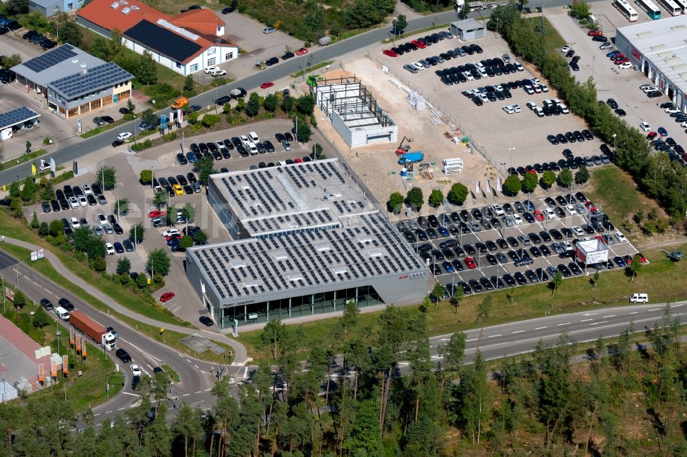 Aerial image Roth - Car dealership building of the used car dealer Feser, Graf & Co. Automobil Holding GmbH overlooking the construction site a new building in the Kupferschmiedstrasse in Roth in the state Bavaria, Germany