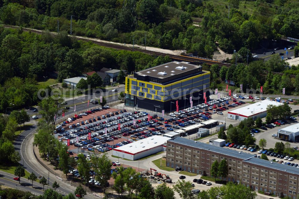 Aerial image Berlin - Parking lot and storage area for automobiles - cars and the car dealership building of the Autoland Berlin branch on the Alt-Friedrichsfelde street in the Marzahn district in Berlin, Germany