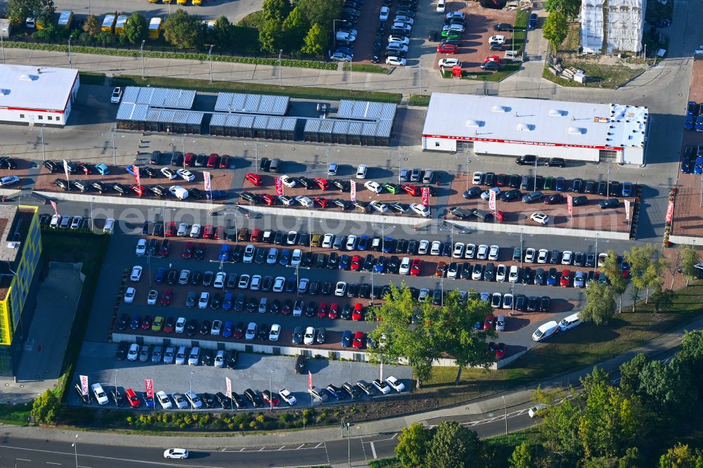 Berlin from above - Parking lot and storage area for automobiles - cars and the car dealership building of the Autoland Berlin branch on the Alt-Friedrichsfelde street in the Marzahn district in Berlin, Germany
