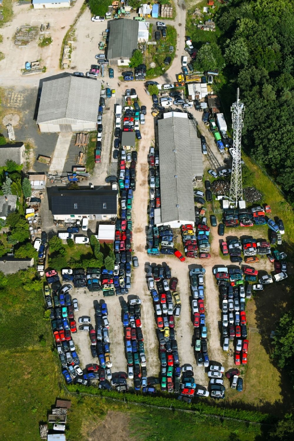 Aerial image Falkenberg - Scrapyard for recycling of cars cars and used vehicles with decomposition and aftermarket Autoverwertung Domke-Krause in Gewerbegebiet in Falkenberg in the state Brandenburg, Germany