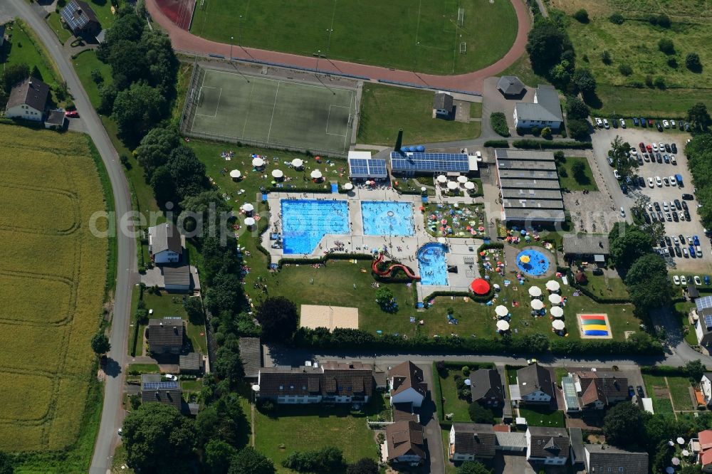 Beverungen from above - Bathers on the lawn by the pool of the swimming pool Die Batze Erlebnisbad in Beverungen in the state North Rhine-Westphalia, Germany