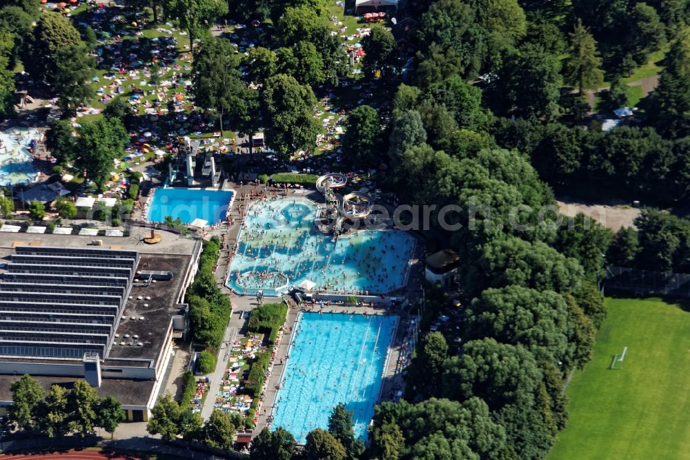 Aerial image Unterhaching - Bathers on the lawn by the swimming pool in Unterhaching in the state Bavaria, Germany