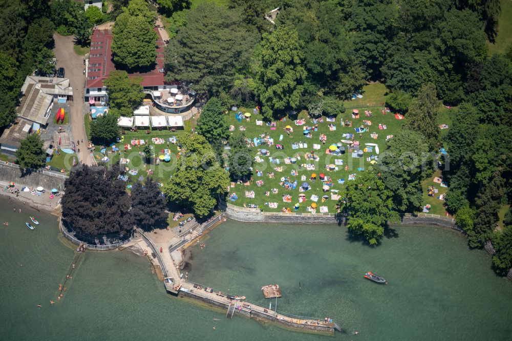 Aerial image Bad Schachen - Bathers look to cool off in summer on the banks of the lake Lake Constance in Bad Schachen at Bodensee in the state Bavaria, Germany