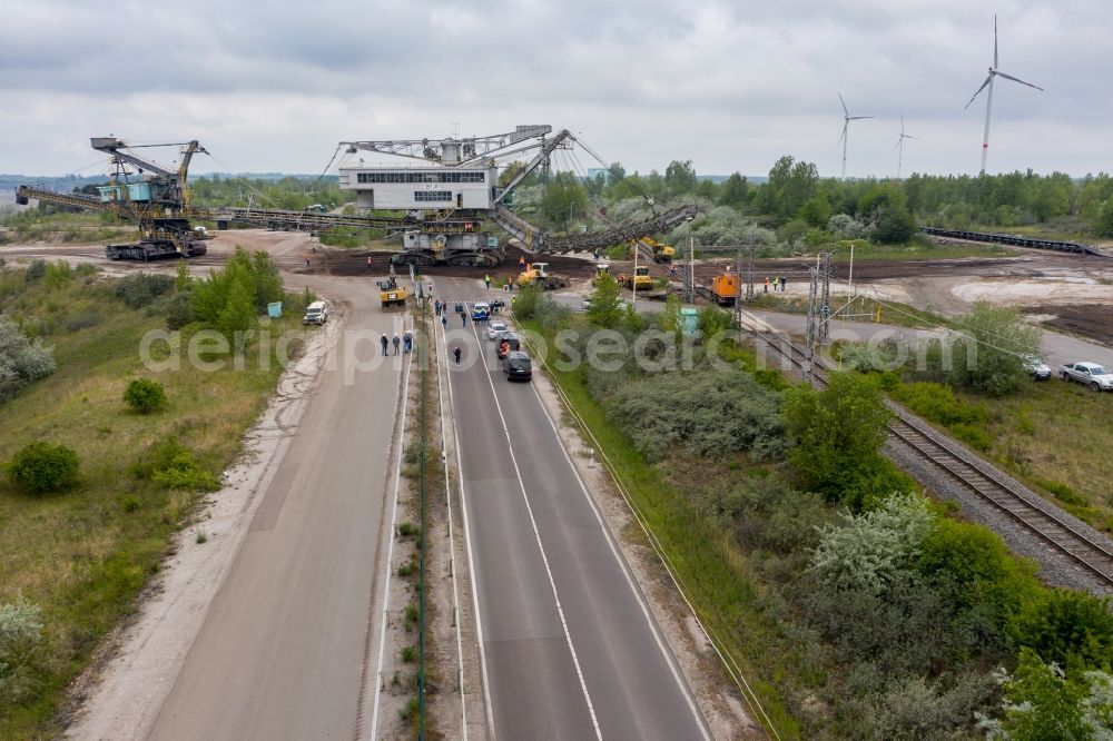 Profen from the bird's eye view: Dredging conveyor bridge in brown coal mine beim Umsetzen ueber eine Landstrasse and Bahnlinie in Profen in the state Saxony-Anhalt, Germany