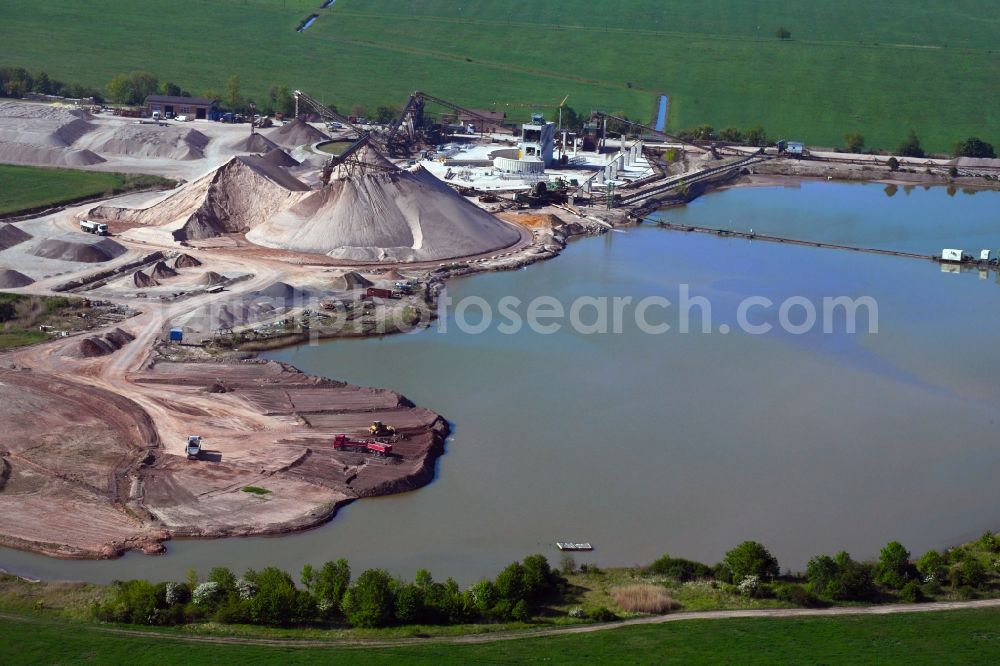 Wildeck from above - Lake shore and overburden areas of the quarry lake and gravel open pit on Auweg in the district Obersuhl in Wildeck in the state Hesse, Germany
