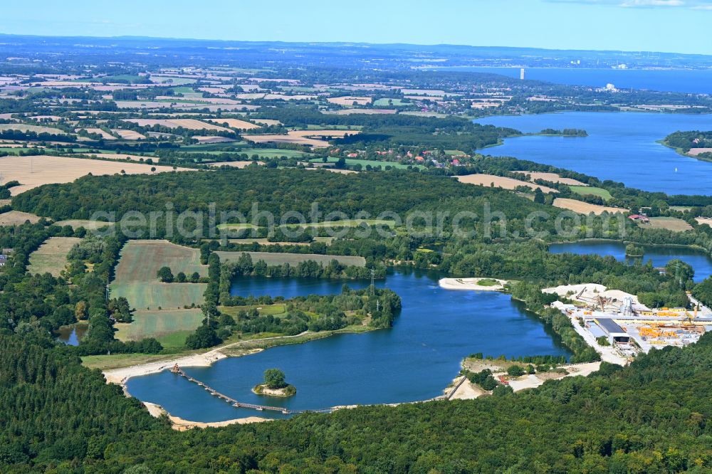 Ratekau from above - Lake shore and overburden areas of the quarry pond and gravel opencast mine and concrete plant of Friedrich Schuett + Sohn Baugesellschaft mbH & Co. KG in Ratekau in the state Schleswig-Holstein, Germany