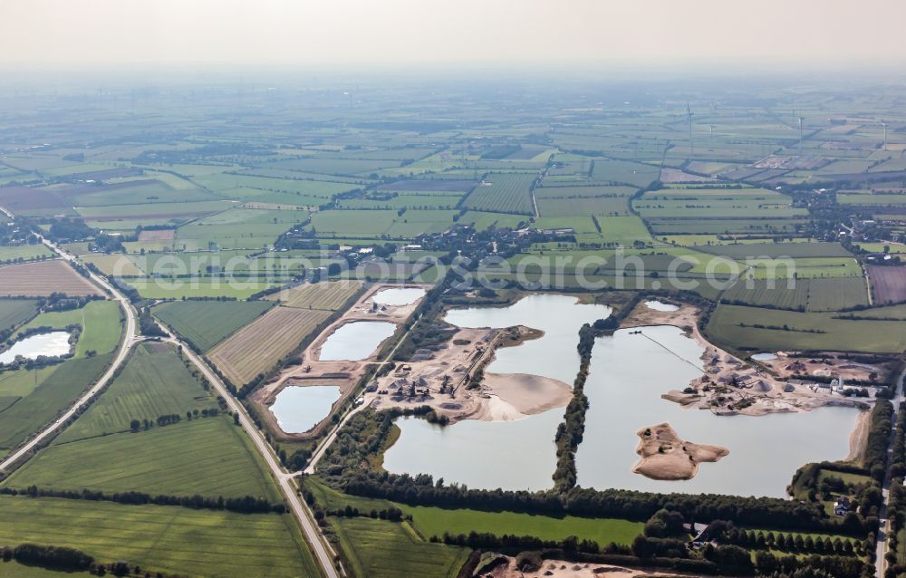 Handewitt from above - Lake shore and overburden areas of the quarry lake and gravel open pit in Handewitt in the state Schleswig-Holstein, Germany