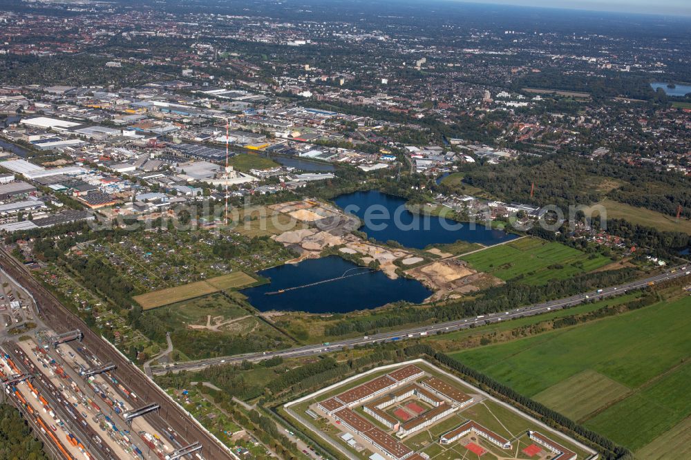 Hamburg from the bird's eye view: Lake shore and overburden areas of the quarry lake and gravel open pit of RBS Kiesgewinnung GmbH & Co. KG in the district Billbrook in Hamburg, Germany