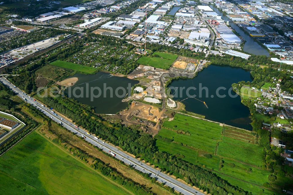 Hamburg from the bird's eye view: Lake shore and overburden areas of the quarry lake and gravel open pit of RBS Kiesgewinnung GmbH & Co. KG in the district Billbrook in Hamburg, Germany