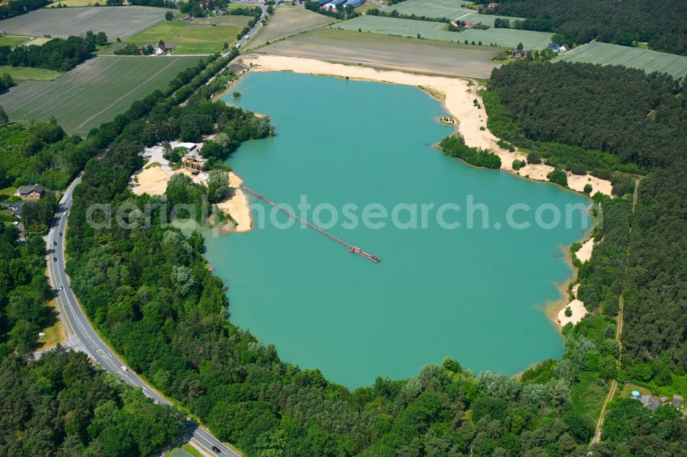 Stukenbrock from above - Lake shore and overburden areas of the quarry lake and gravel open pit Sandgrube Brink on street Augustdorfer Strasse in Stukenbrock in the state North Rhine-Westphalia, Germany