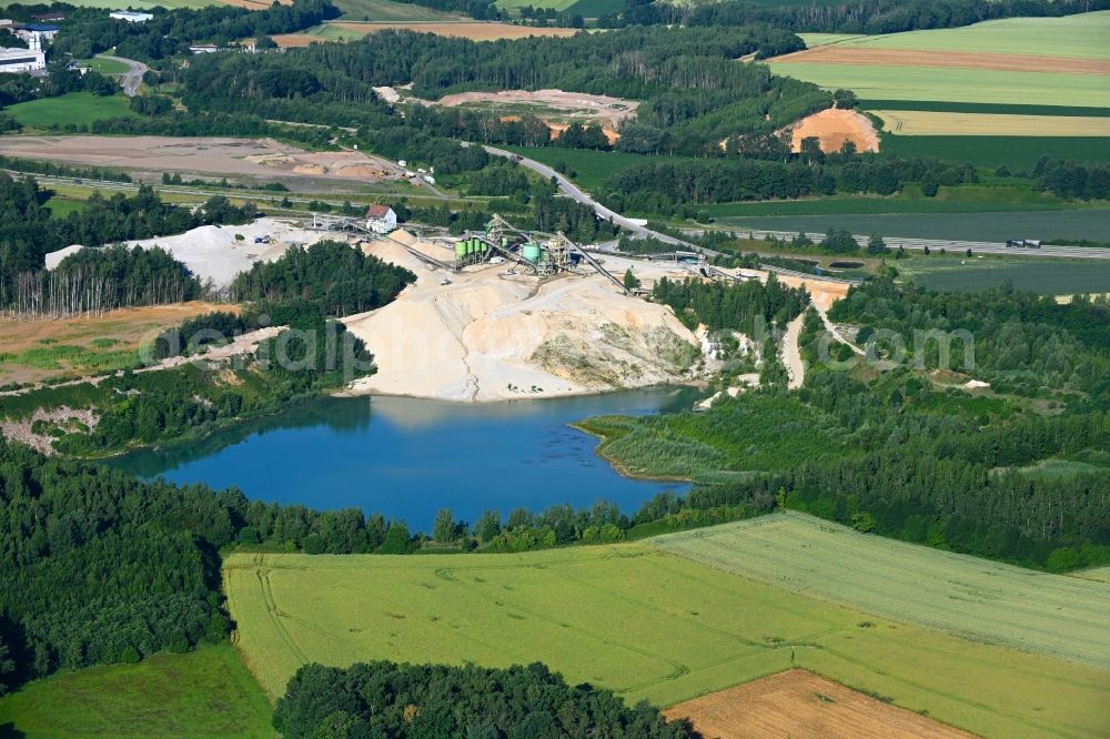 Aerial image Wernsdorf - Lake shore and overburden areas of the quarry lake and gravel open pit - Sandgrube in Wernsdorf in the state Saxony, Germany