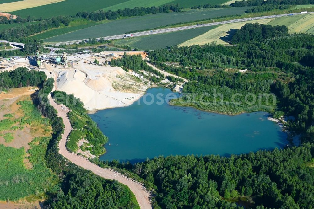 Aerial photograph Wernsdorf - Lake shore and overburden areas of the quarry lake and gravel open pit - Sandgrube in Wernsdorf in the state Saxony, Germany