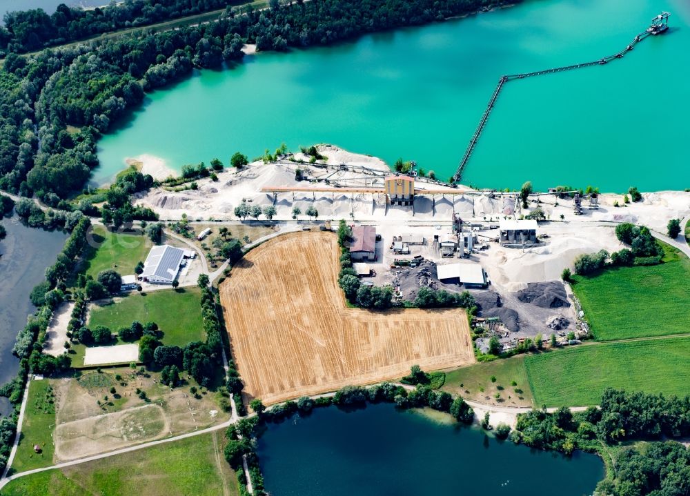 Schwanau from above - Lake shore and overburden areas of the quarry lake and gravel open pit of Vogel-Bau GmbH in Schwanau in the state Baden-Wuerttemberg, Germany