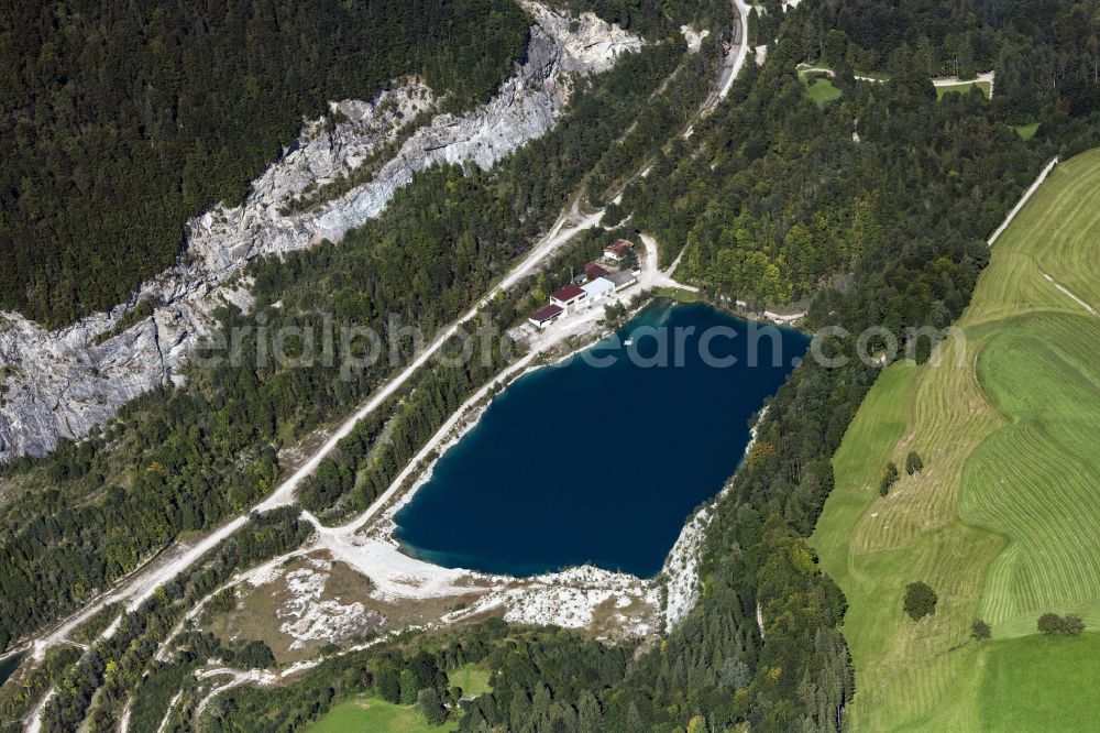 Vorderthiersee from above - Lake shore and overburden areas of the quarry lake and gravel open pit in Vorderthiersee in Tirol, Austria