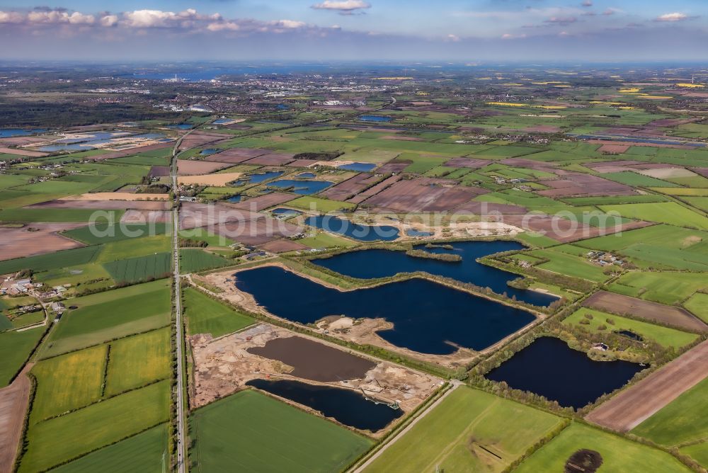 Aerial image Wanderup - Lake shore and overburden areas of the quarry lake and gravel open pit in Wanderup in the state Schleswig-Holstein, Germany