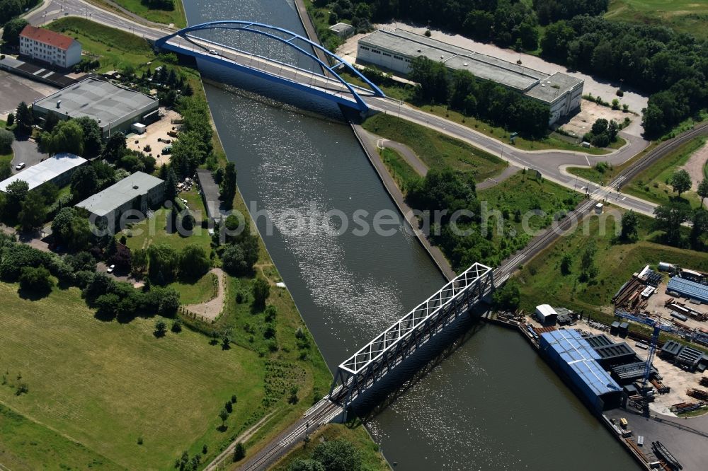 Aerial image Genthin - Railway bridge and blue steel arc bridge with the federal road B1 across the Elbe-Havel-Canal in the Northeast of Genthin in the state of Saxony-Anhalt