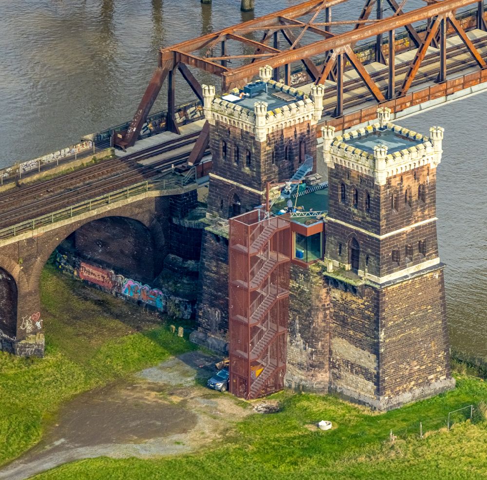 Aerial photograph Duisburg - Railway bridge construction Hochfelder Eisenbahnbruecke with the Bridge Tower Rheinhausen Duisburg on river Rhine in the district Friemersheim in Duisburg in the Ruhr area in the state North Rhine-Westphalia, Germany