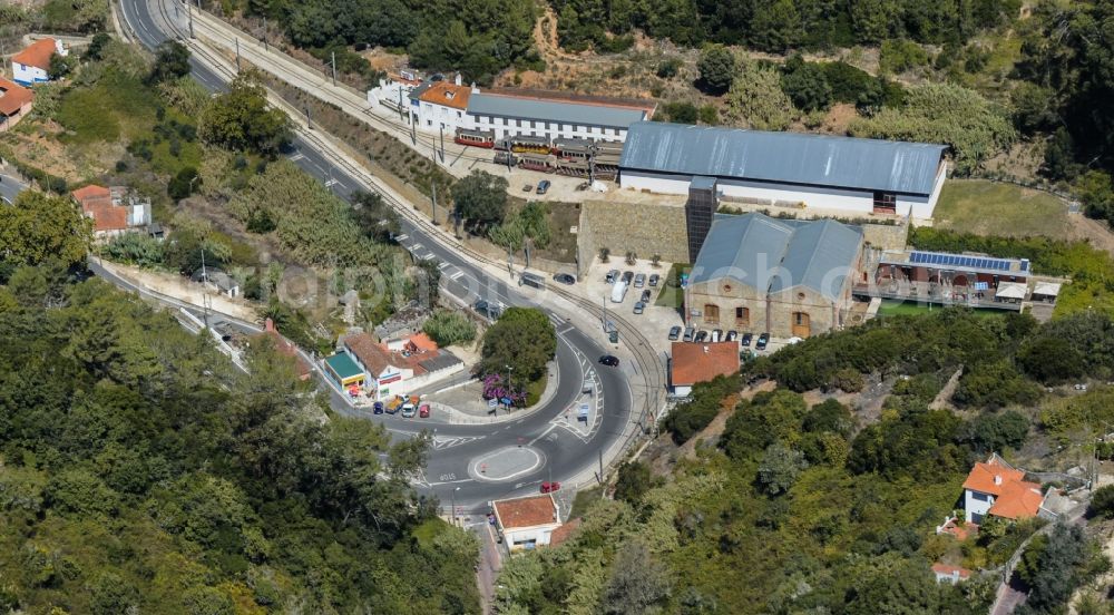 Sintra from the bird's eye view: Railway depot and repair shop for maintenance and repair of trains of passenger transport of the series Estrada Nacional in the district Ribeira in Sintra, Portugal