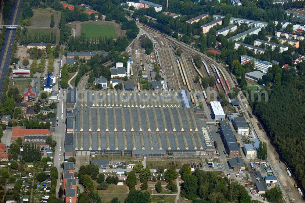 Berlin from the bird's eye view: Railway depot and repair shop for maintenance and repair of trains of passenger transport of the series of S- Bahn in the district Schoeneweide in Berlin, Germany