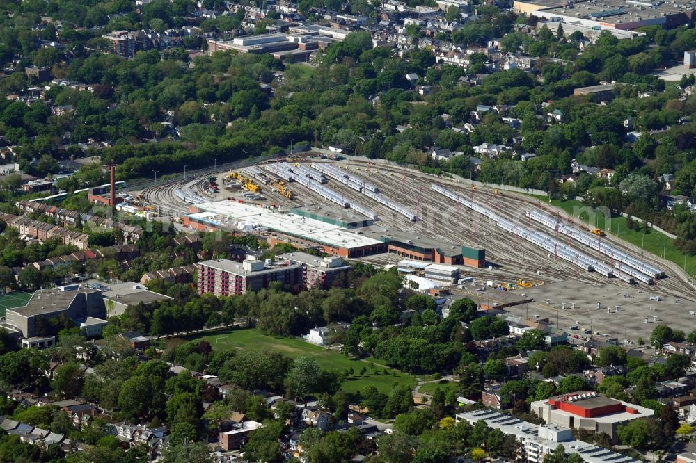 Toronto from above - Railway depot and repair shop for maintenance and repair of trains of passenger transport of the series of TTC Greenwood Yard on Greenwood Ave in Toronto in Ontario, Canada